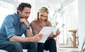 Shot of a married couple working on their budget together